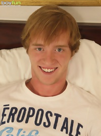 Cute Kyler Madison stuffs fingers into his ass