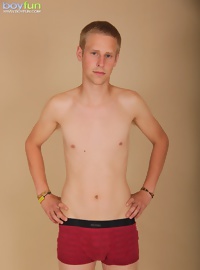 Twink Zack Kane spreads his asshole wide apart.