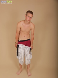 Twink Zack Kane spreads his asshole wide apart.