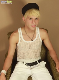 Blond twink Angel Villanueva tugs on his thick cock