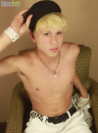 Blond twink Angel Villanueva tugs on his thick cock