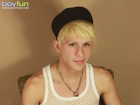 Blond twink Angel Villanueva tugs on his thick cock