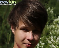 Cute boy Desmond Hall busts a nut in the backyard